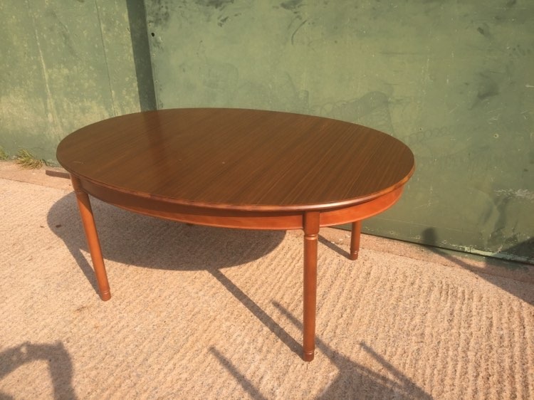 Oval extending dining table with butterfly leaves inside. 110cm wide, 67cm tall, 156cm long or 200cm long when extended. Legs are removable for ease of transportation.